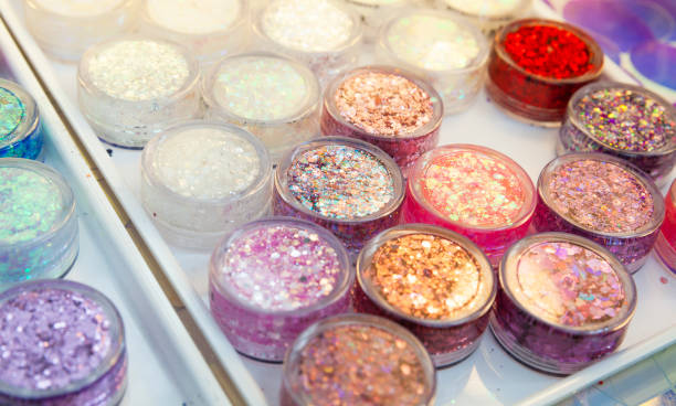 istock Palette of colorful shiny glitter in plastic cans 1283809936