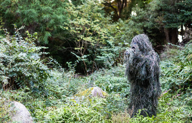 istock Ghillie suit sniper in the jungle 1283811117