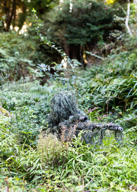 istock Ghillie suit sniper in the jungle 1283811125