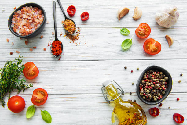 istock Tomato, basil and pepper with garlic on white wooden background 1283812964