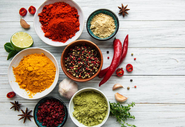 istock Various spices  on white wooden background, top view 1283812965