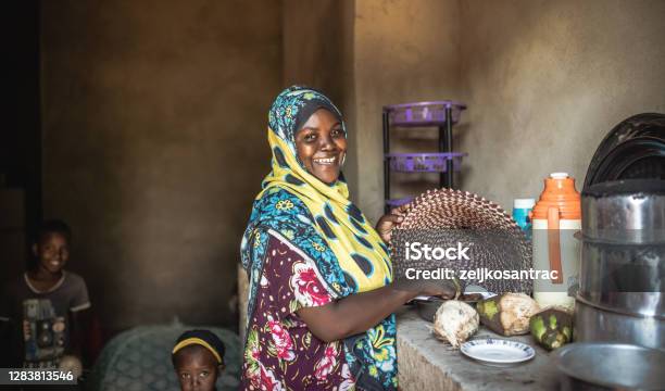 African Family Eating Healthy Food Together Stock Photo - Download Image Now - Tanzania, Africa, Cooking