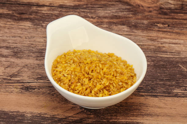 istock Vegetarian cuisine - dry bulgur for cooking 1283813776