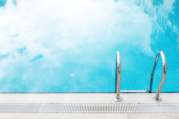 istock Sunny swimming pool in tropical resort 1283815009