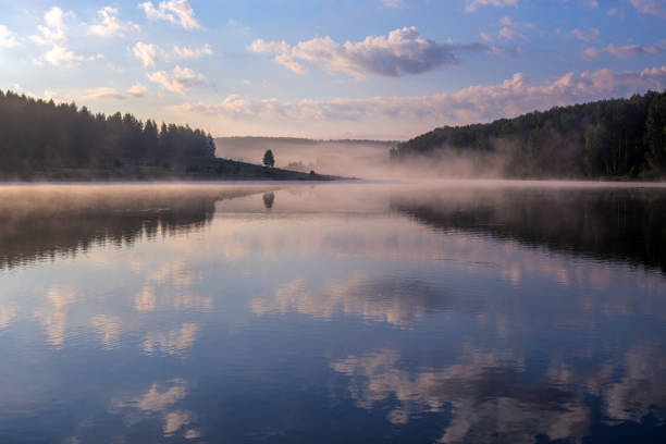 istock foggy lakeside at sunrise without foreground wide angle 1283816367