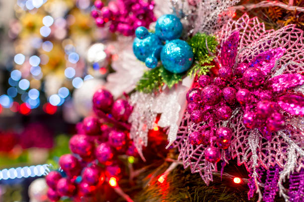 Closeup of pink and blue Christmas ornaments decorated on a Geneva style Christmas Tree. Blurred bokeh of lights as background. Displayed at a local shop or department store for sale. Closeup of pink and blue Christmas ornaments decorated on a Geneva style Christmas Tree. Blurred bokeh of lights as background. Displayed at a local shop or department store for sale. divisoria market stock pictures, royalty-free photos & images