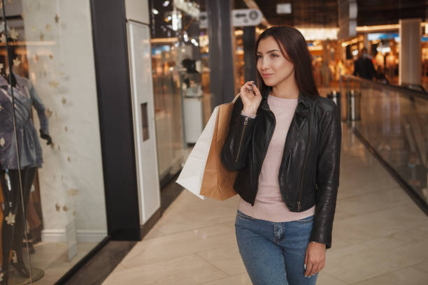 istock Charming female customer at shopping mall 1283818509