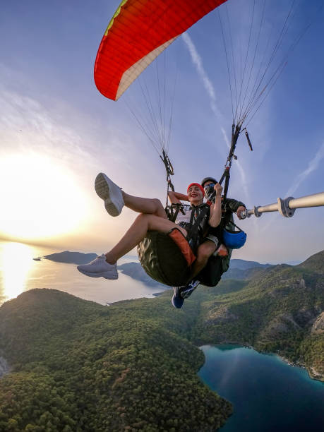 istock Paragliding pilot with customer. Tandem paragliding. 1283819315