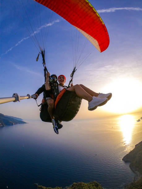 istock Paragliding pilot with customer. Tandem paragliding. 1283819446
