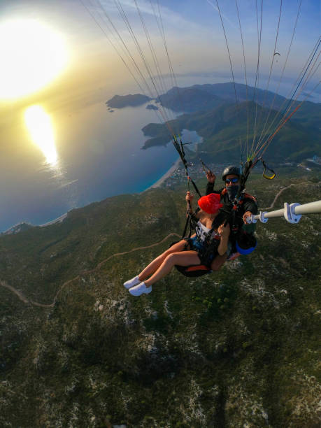 istock Paragliding pilot with customer. Tandem paragliding. 1283819486