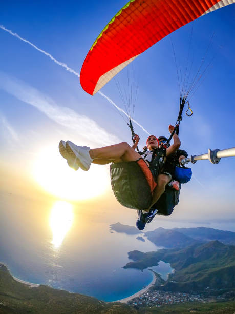 istock Paragliding pilot with customer. Tandem paragliding. 1283819517