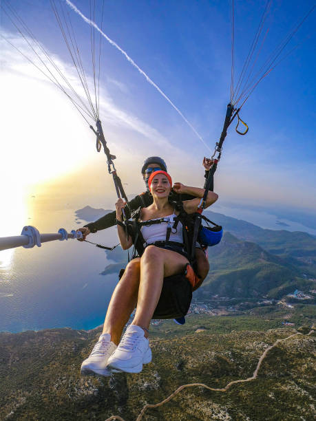 istock Paragliding pilot with customer. Tandem paragliding. 1283819540