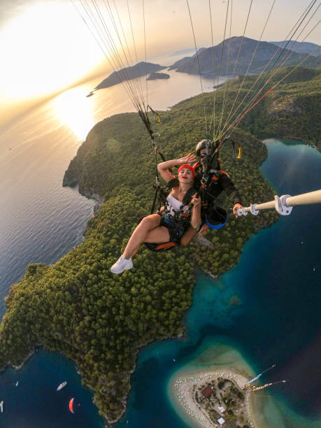 istock Paragliding pilot with customer. Tandem paragliding. 1283819765
