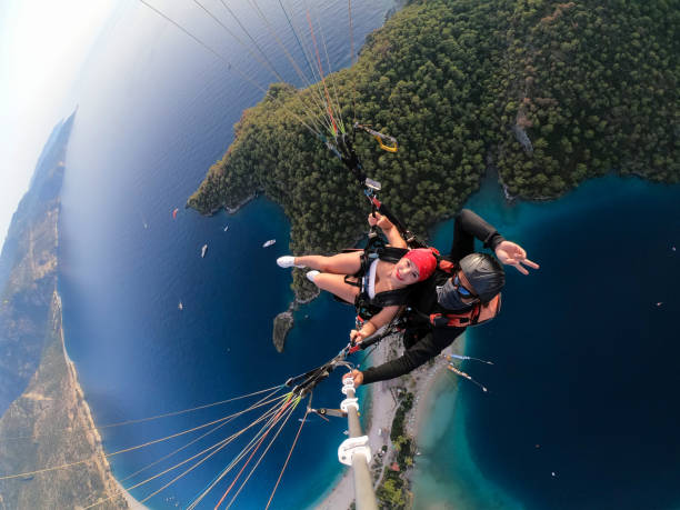 istock Paragliding pilot with customer. Tandem paragliding. 1283819890