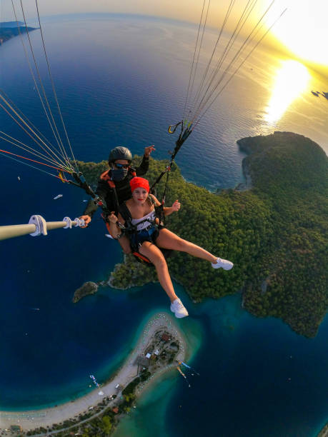 istock Paragliding pilot with customer. Tandem paragliding. 1283819961