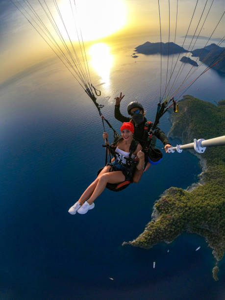 istock Paragliding pilot with customer. Tandem paragliding. 1283820025