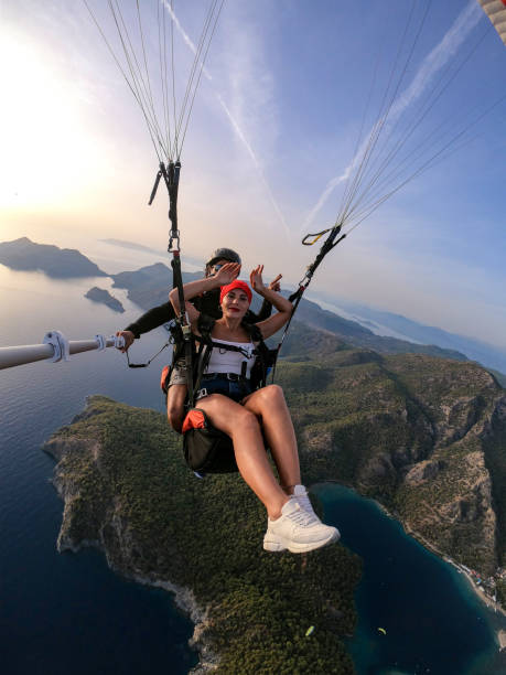 istock Paragliding pilot with customer. Tandem paragliding. 1283820163
