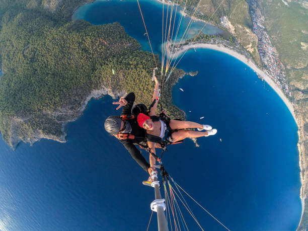 istock Paragliding pilot with customer. Tandem paragliding. 1283820768