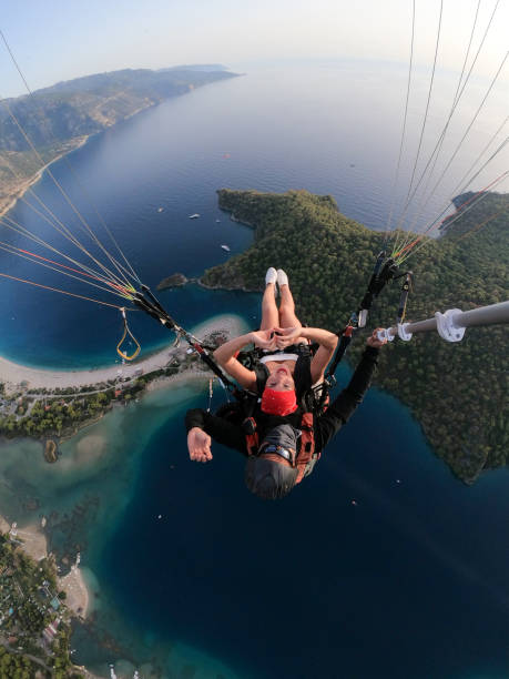 istock Paragliding pilot with customer. Tandem paragliding. 1283821301