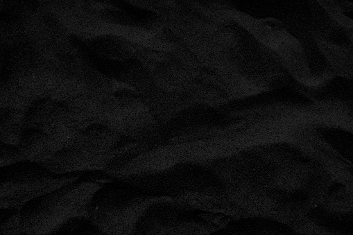 Black sand texture background. Black Friday background concept.
