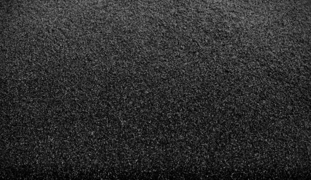 istock Black sand texture background. Black Friday background concept. 1283821674
