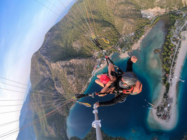 istock Paragliding pilot with customer. Tandem paragliding. 1283821851