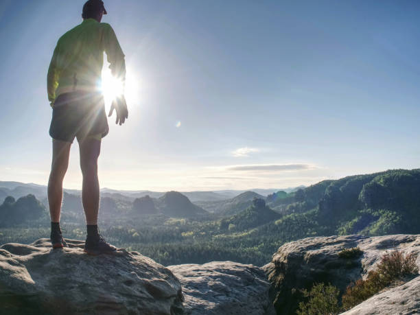 istock Strong And Fit Athletic Man Workout During Trail Marathon On Mountain Path. Sunny Flares Amazing Dsy 1283821852