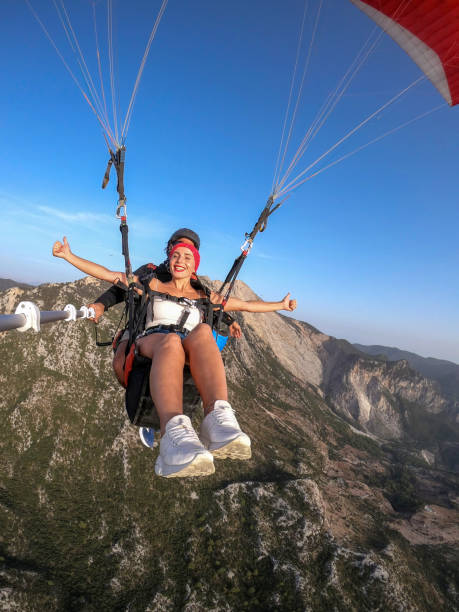 istock Paragliding pilot with customer. Tandem paragliding. 1283822592
