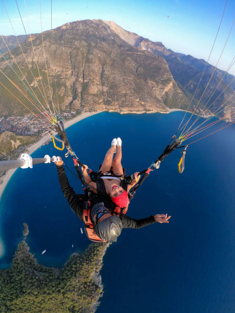 istock Paragliding pilot with customer. Tandem paragliding. 1283822637
