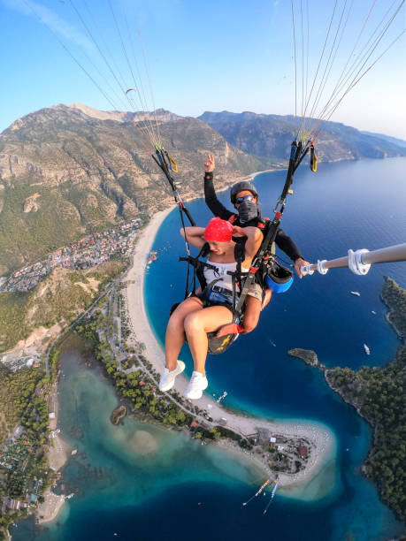 istock Paragliding pilot with customer. Tandem paragliding. 1283822744