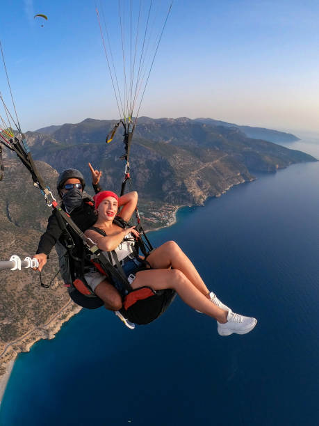 istock Paragliding pilot with customer. Tandem paragliding. 1283822843