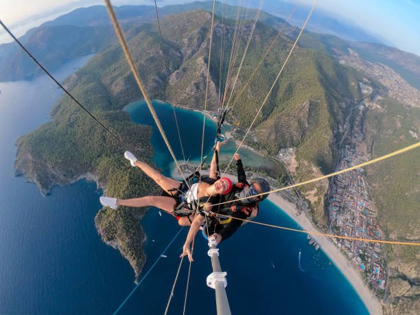 istock Paragliding pilot with customer. Tandem paragliding. 1283822909