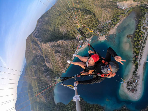 istock Paragliding pilot with customer. Tandem paragliding. 1283823163