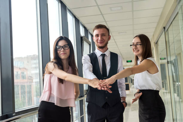 istock Three business people shaking hands after successful meeting 1283823570
