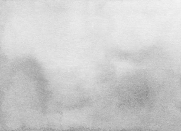 istock Watercolor light gray gradient background texture. Black and white watercolour backdrop. Grey stains on paper. 1283824125