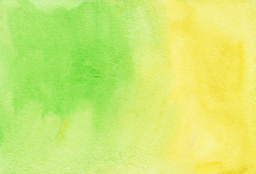 Watercolor bright green and yellow background texture. Stains on paper.