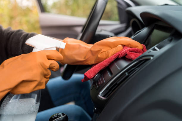 istock hand in protective gloves cleaning car interior from coronavirus covid-19 using microfiber clothes 1283826073