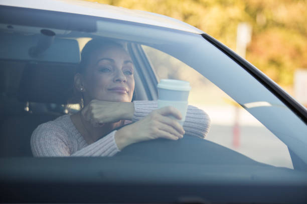 istock Bored woman waiting for traffic to move 1283826773
