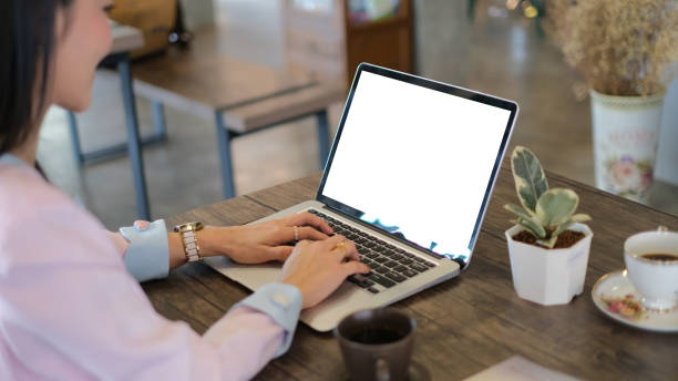istock A businesswoman typing on laptop with empty screen at her workplace. 1283826869