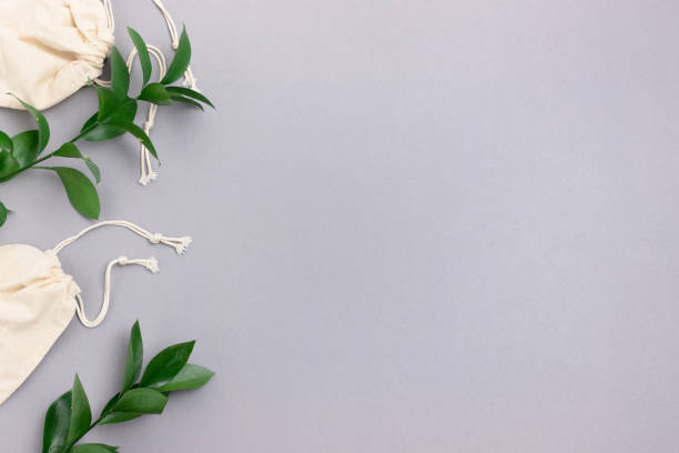 istock Canvas bags and green leaves. Zero waste concept with place for your text. 1283827995