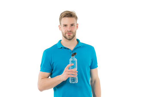 Required amount of minerals and salts. Stay hydrated. Man athletic sportsman hold bottle water. Healthy lifestyle. Drink water. Vitamin and minerals. Handsome man healthy habit. Sparkling water.