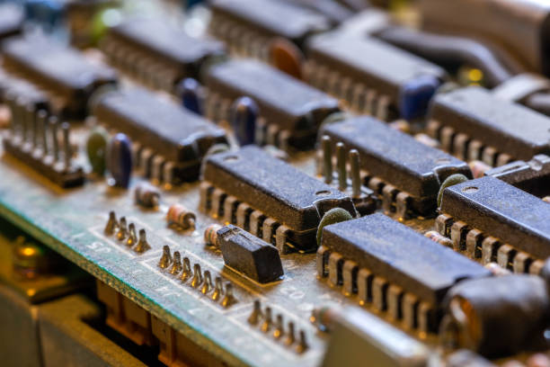 istock dark background of old electronic circuit board closeup with dus 1283834358