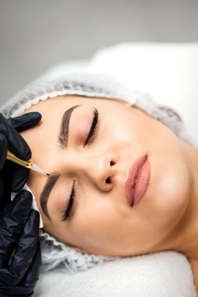 istock Permanent makeup on eyebrows of woman 1283835507