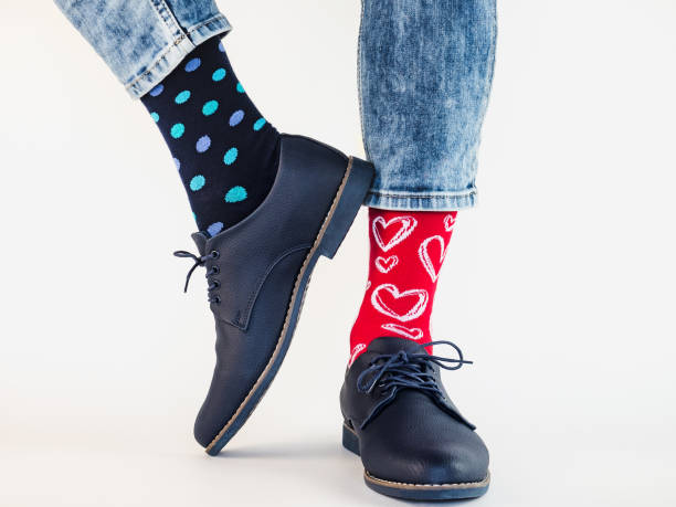 istock Men's legs, trendy shoes and bright socks 1283837833