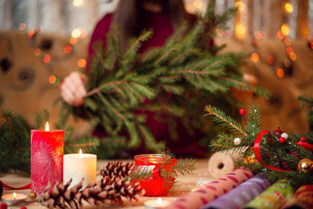 istock Candles and christmas decoration on the wooden table. 1283839921