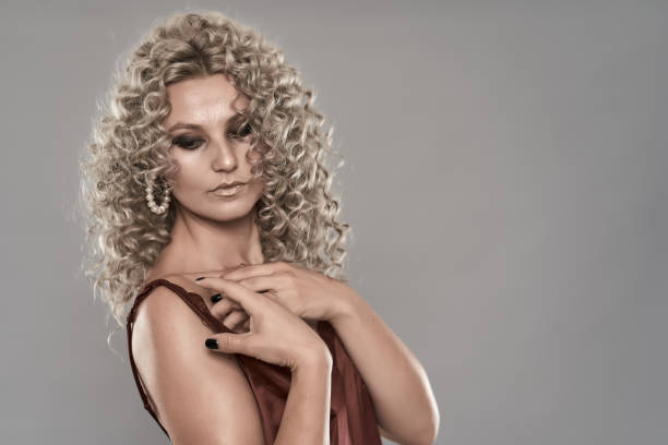 istock Glamour model with curly blond hair 1283840120