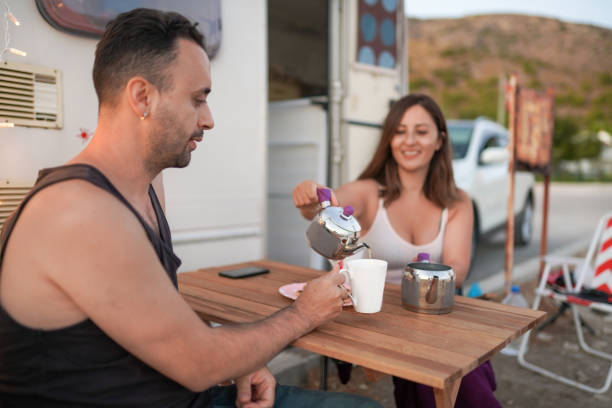 istock Young couple brewing tea in their caravan 1283840455