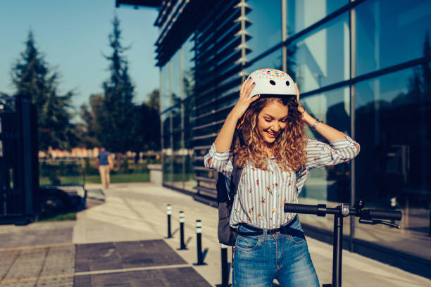 istock She is happy to ride electric push scooter 1283840480