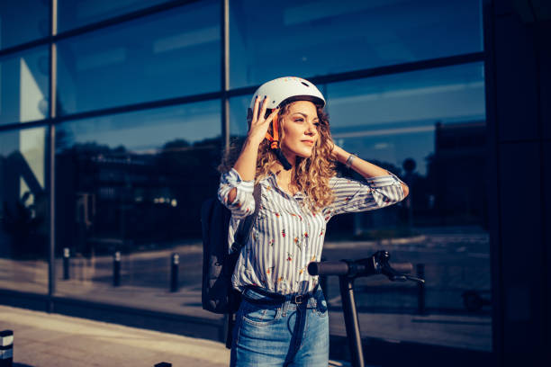 Smiling woman puts crash helmet