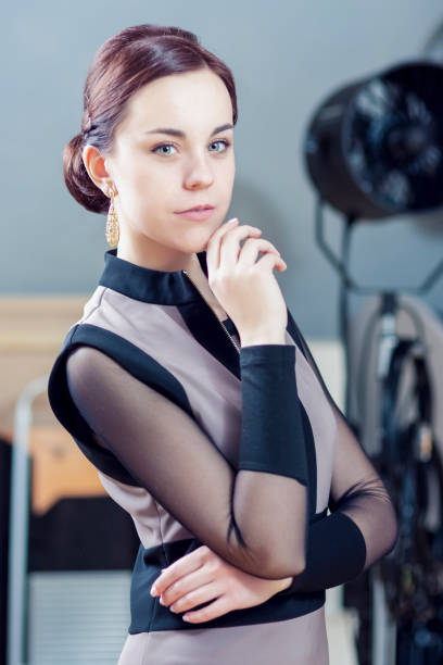 istock Positive Confident Caucasian Woman With Lifted Hand in Studio Environment. Vertical image Composition 1283842632